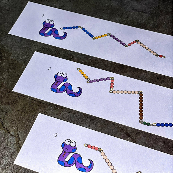 First three out of forty JRMontessori snake game cards showing card number, a cartoon snake, and a bead stair snake