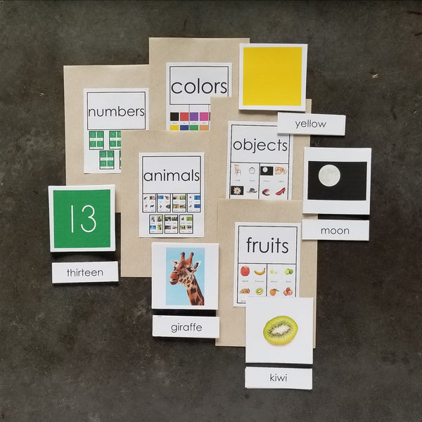 Brown envelopes with colorful labels showing examples of how to display JRMontessori matching cards. 