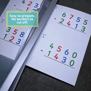 Sheet of JRMontessori task cards in a guillotine style paper cutter